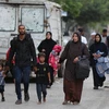 Người dân Palestine rời bỏ nhà cửa tránh xung đột tại Rafah, Dải Gaza, ngày 28/5. (Ảnh: THX/TTXVN)