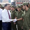 Chủ tịch nước Tô Lâm động viên lực lượng tham gia bảo vệ an ninh trật tự ở cơ sở của Thành phố Hồ Chí Minh. (Ảnh: Nhan Sáng/TTXVN)