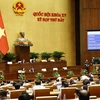 Quốc hội biểu quyết thông qua Nghị quyết về phê chuẩn quyết toán ngân sách nhà nước năm 2022. (Ảnh: Doãn Tấn/TTXVN)