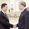 Chủ tịch nước Tô Lâm với Thủ tướng Campuchia Hun Manet. (Ảnh: Nhan Sáng/TTXVN)