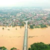 Nước sông Hồng lên cao, nhấn chìm các khu vực nằm ven sông ở thành phố Yên Bái, chiều 9/9. (Ảnh: Tuấn Anh /TTXVN)