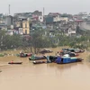 Lũ lên cao gây ngập lụt, cảnh báo cấp độ rủi ro thiên tai do lũ tại Hà Nội ở cấp 2. (Ảnh: Minh Quyết/TTXVN)