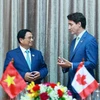 Thủ tướng Phạm Minh Chính gặp Thủ tướng Canada Justin Trudeau. (Ảnh: Dương Giang/TTXVN)