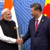 Thủ tướng Ấn Độ Narendra Modi (trái) và Chủ tịch Trung Quốc Tập Cận Bình tại cuộc gặp bên lề Hội nghị cấp cao BRICS ở Kazan, Nga, ngày 23/10/2024. (Ảnh: ANI/TTXVN)