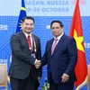 Thủ tướng Phạm Minh Chính tiếp Bộ trưởng Kinh tế Malaysia Rafizi Ramli. (Ảnh: Dương Giang/TTXVN)