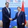 Thủ tướng Phạm Minh Chính gặp Tổng thống Venezuela Nicolas Maduro. (Ảnh: Dương Giang/TTXVN)