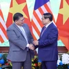 Thủ tướng Chính phủ Phạm Minh Chính với Chủ tịch Hạ viện Malaysia Tan Sri Dato’ Johari Bin Abdul. (Ảnh: Phạm Kiên/TTXVN)