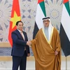 Phó Tổng thống UAE Sheikh Mansour Bin Zayed Al Nahyan chủ trì Lễ đón Thủ tướng Phạm Minh Chính thăm chính thức Các Tiểu Vương quốc Arab Thống nhất (UAE). (Ảnh: Dương Giang/TTXVN)