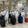 Lao động Việt Nam nhập cảnh tại Sân bay Incheon. Hàn Quốc. (Ảnh: TTXVN)