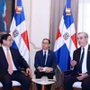 Thủ tướng Phạm Minh Chính gặp hẹp Tổng thống Dominicana Luis Abinader Corona trước hội đàm chính thức. (Ảnh: Dương Giang/TTXVN)