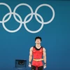 Đô cử Trịnh Văn Vinh thất vọng khi thi đấu không thành công tại Olympic Paris 2024. (Ảnh: Hoàng Linh/TTXVN)