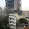 Một ngọn lửa đã bất ngờ bùng phát tại tòa nhà 2 tầng, vốn là trường quay cũ (Ảnh: CTV/Vietnam+)