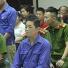 Bị can Nguyễn Kim Hưng tại phiên tòa xét xử vụ bảo kê chợ Long Biên. (Ảnh: PV/Vietnam+)