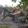 Binh sỹ Ukraine sử dụng súng phóng lựu tự động trong cuộc xung đột với lực lượng ly khai miền đông ở gần Avdeevka, vùng Donetsk. (Nguồn: AFP/TTXVN)