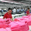 Sản xuất hàng may mặc xuất khẩu tại Công ty Trách nhiệm hữu hạn Hansae Việt Nam tại Thành phố Hồ Chí Minh. (Ảnh: Thanh Vũ/TTXVN)
