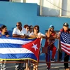 Người dân thủ đô La Habana đón chào sự kiện Mỹ chính thức mở lại Đại sứ quán tại Cuba. (Ảnh: Lê Hà/TTXVN)
