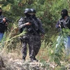 Cảnh sát đặc nhiệm Venezuela gác tại thành phố San Antonio, bang Tachira, giáp giới với Colombia ngày 28/8. (Nguồn: AFP/TTXVN)