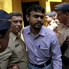 Một nghi phạm vụ đánh bom hàng loạt được áp giải tới phiên tòa ở Mumbai ngày 30/9. (Nguồn: Reuter/TTXVN)