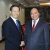 Phó Thủ tướng Nguyễn Xuân Phúc tiếp ông Bành Thanh Hoa. (Ảnh: An Đăng/TTXVN)