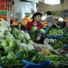 Rau củ được bán tại một khu chợ ở Thượng Hải. (Nguồn: AFP/TTXVN)