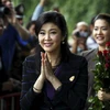 Cựu Thủ tướng Yingluck Shinawatra (giữa) tới Tòa án tối cao ở Bangkok. (Nguồn: Reuters/TTXVN)