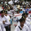 Tuần hành tại Iguala, yêu cầu điều tra toàn diện về vụ 43 sinh viên mất tích. (Nguồn: AFP/TXVN)