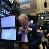 Các nhà giao dịch tại thị trường chứng khoán New York. (Nguồn: AFP/TTXVN)