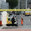 Cảnh sát phong tỏa hiện trường vụ nổ ở sân vận động Manchester để phục vụ công tác điều tra. (Nguồn: EPA/TTXVN)