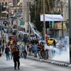 Người biểu tình Palestine xung đột với cảnh sát Israel tại khu vực Bethlehem thuộc Bờ Tây ngày 19/7. (Nguồn: AFP/TTXVN)