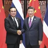 Thủ tướng Prayut Chan-ocha (trái) đã hội đàm với Chủ tịch Trung Quốc Tập Cận Bình. (Nguồn: THX/TTXVN)