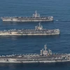 Tàu sân bay USS Ronald Reagan, Theodore Roosevelt và Nimitz của Mỹ tham gia cuộc tập trận chung Hàn Quốc-Mỹ trên biển phía Đông Hàn Quốc ngày 12/11. (Nguồn: Yonhap/TTXVN)