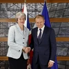 Chủ tịch Hội đồng châu Âu Donald Tusk và Thủ tướng Anh Theresa May bên lề một Hội nghị cấp cao tại Brussels. (Nguồn: AFP/TTXVN))