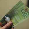  Đồng tiền mệnh giá 20 đôla Canada. (Nguồn: AFP/TTXVN)