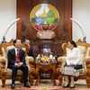 Chủ tịch Quốc hội Lào Pany Yathotou tiếp Bộ trưởng Phạm Hồng Hà. (Ảnh: Phạm Kiên/Vietnam+)