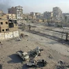 Cảnh đổ nát sau giao tranh tại Deir el-Zour, Syria. (Nguồn: AFP/TTXVN)