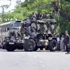 Cảnh sát tuần tra tại Pallekele, huyện Kandy, Sri Lanka ngày 6/3. (Nguồn: AFP/TTXVN)