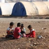 Trẻ em tại một trại tị nạn ở Khazir, Iraq. (Nguồn: THX/TTXVN)
