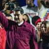 Tổng thống Venezuela Nicolas Maduro (trái, trước) sau khi Ủy ban bầu cử quốc gia công bố kết quả bầu cử Tổng thống tại Caracas ngày 20/5. (Nguồn: AFP/TTXVN)