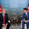 Thủ tướng Canada Justin Trudea hội đàm với Tổng thống Mỹ Donald Trump bên lề hội nghị G7. (Nguồn: AFP/TTXVN)