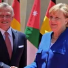 Quốc vương Jordan và Thủ tướng Đức Angela Merkel. (Nguồn: AFP) 
