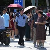 Cảnh sát phong tỏa khu vực bên ngoài Đại sứ quán Mỹ ở Bắc Kinh sau vụ nổ ngày 26/7. (Ảnh: AFP/TTXVN)