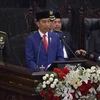 Tổng thống Indonesia Joko Widodo (giữa) phát biểu tại Quốc hội ở Jakarta ngày 16/8. (Ảnh: AFP/TTXVN)