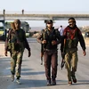  Các tay súng nổi dậy tại khu vực Morek, Syria ngày 21/7. (Ảnh: AFP/TTXVN)