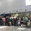 Hành khách tới Bình Nhưỡng xếp hàng tại quầy làm thủ tục của hãng hàng không Triều Tiên Air Koryo ở sân bay quốc tế Bắc Kinh, Trung Quốc ngày 4/9. (Ảnh: Yonhap/TTXVN)