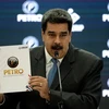 Tổng thống Venezuela Nicolas Maduro trong cuộc họp báo về việc chính thức sử dụng đồng Petro điện tử trong giao dịch quốc tế, ngày 1/10/2018. (Ảnh: AFP/TTXVN)