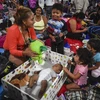 Người tị nạn các nước Trung Mỹ đổ về khu vực biên giới Mexico, để tìm cách qua Mỹ xin tị nạn. (Ảnh: AFP/TTXVN)
