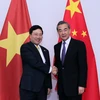Phó Thủ tướng, Bộ trưởng Ngoại giao Phạm Bình Minh gặp Bộ trưởng Ngoại giao Trung Quốc Vương Nghị. (Ảnh: Phạm Kiên/TTXVN)