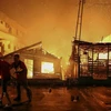 hiện trường vụ hỏa hoạn tại khu nhà tạm ở Manaus, bang Amazonas, Brazil ngày 17/12/2018. (Ảnh: AFP/TTXVN)
