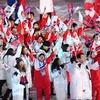 Các vận động viên Hàn Quốc và Triều Tiên tại lễ bế mạc Olympic PyeongChang 2018. (Nguồn: Kyodo/TTXVN)