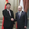 Chủ tịch Trung Quốc Tập Cận Bình (trái) và Tổng thống Nga Vladimir Putin (phải) tại cuộc gặp ở Buenos Aires, Argentina. (Ảnh: THX/TTXVN)